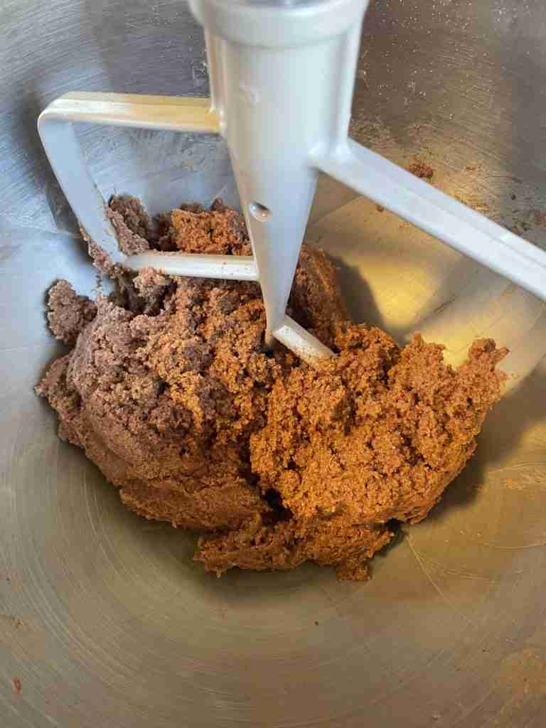 A step in the recipe: Add dry ingredients to wet to make Keto Chocolate-Walnut Cookies.