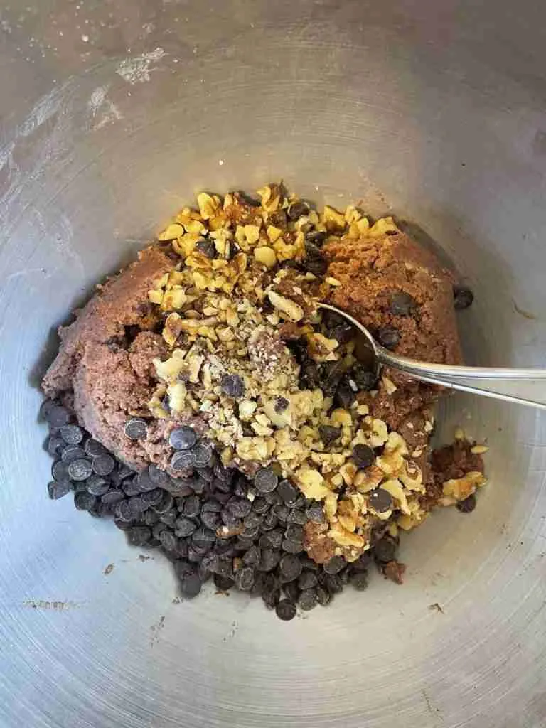 A step in the recipe: Stir in walnuts and sugar-free chocolate chips.