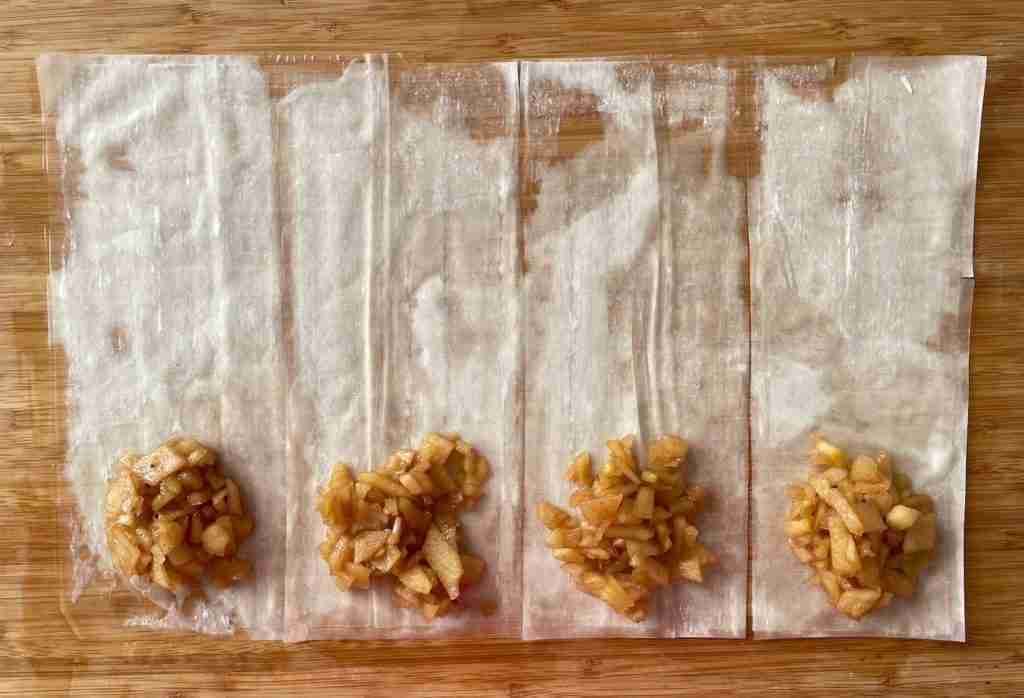 Step one to fold phyllo dough apple turnovers.