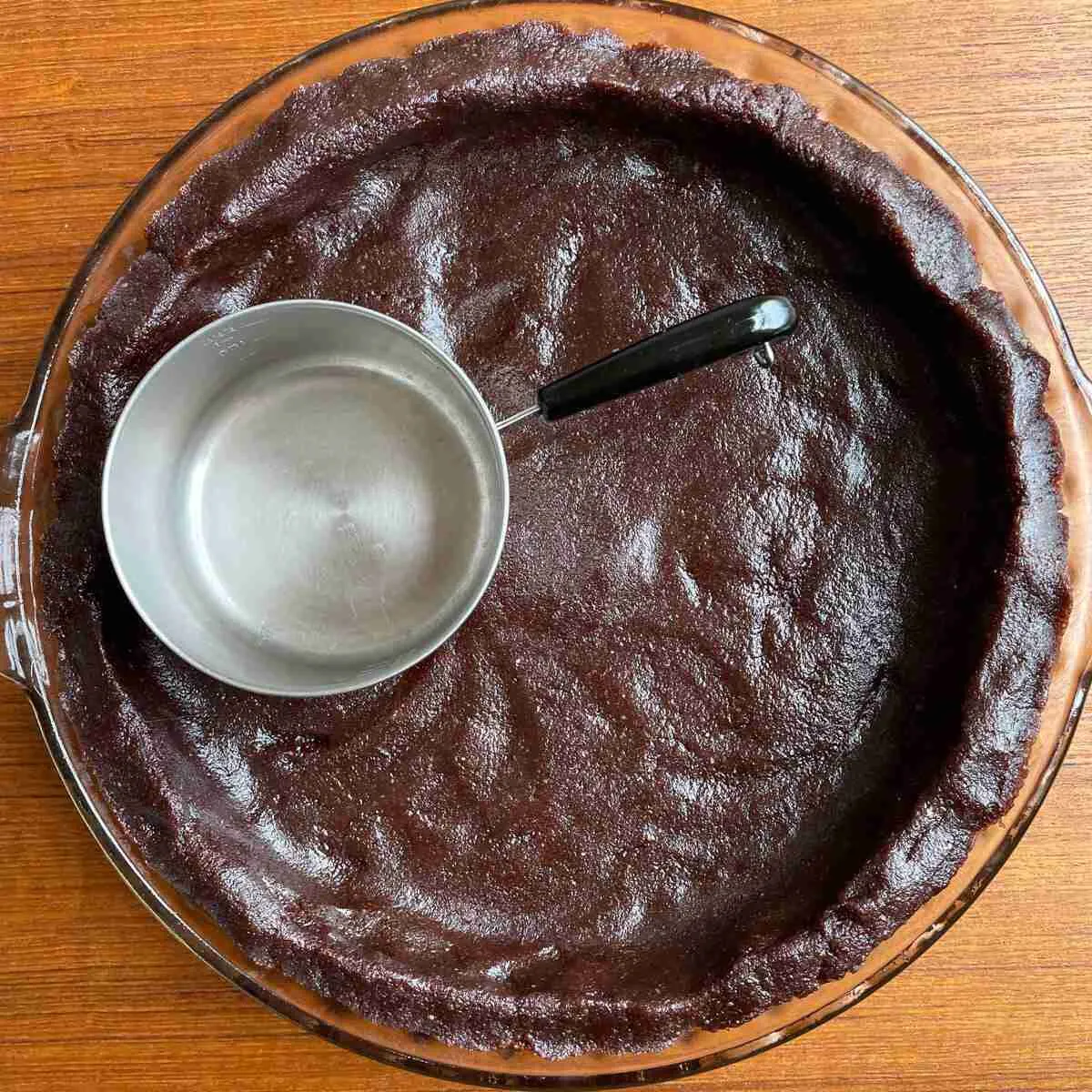 An unbaked, sugarfree, grainfree, keto chocolate pie crust made with dark cocoa powder.