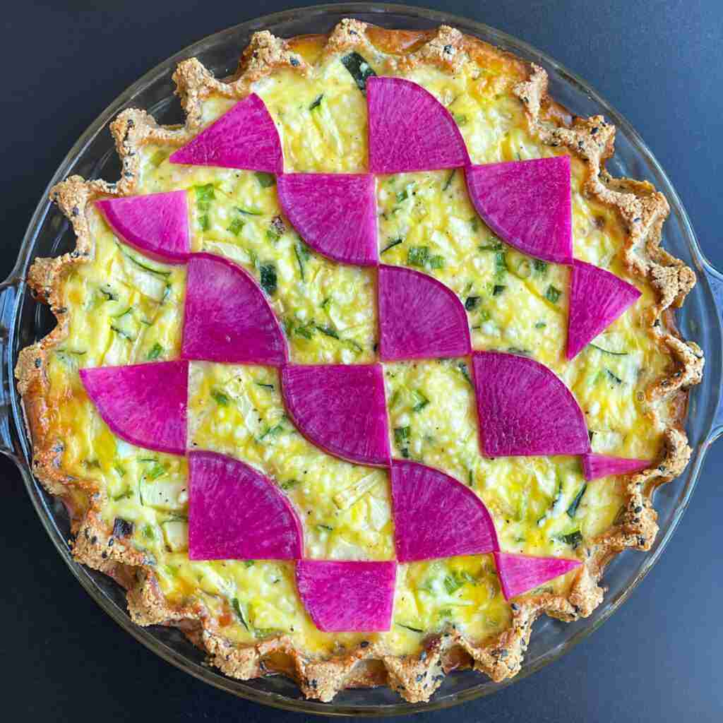 Benefits of baking and music: creative pies such as this low carb Salmon Teriyaki Keto Quiche with magenta watermelon radishes.