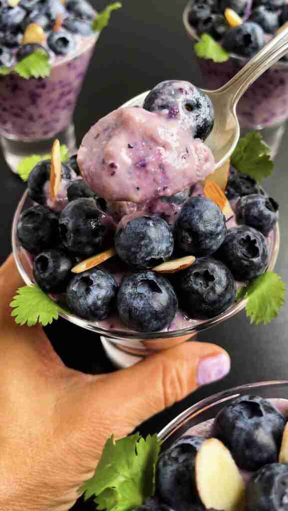 A cup of vegan sugar free blueberry pudding, a vegan dessert recipe.