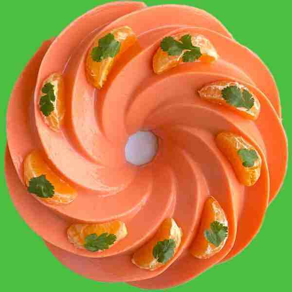 Gelatina de leche, orange Mexican milk jello, made with real fruit and topped with mandarin slices.