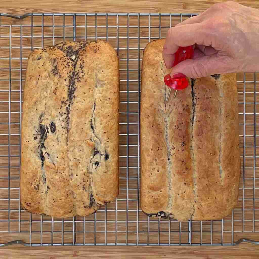 Poke holes in the baked bread so when you brush it with melted butter, the butter really settles in.