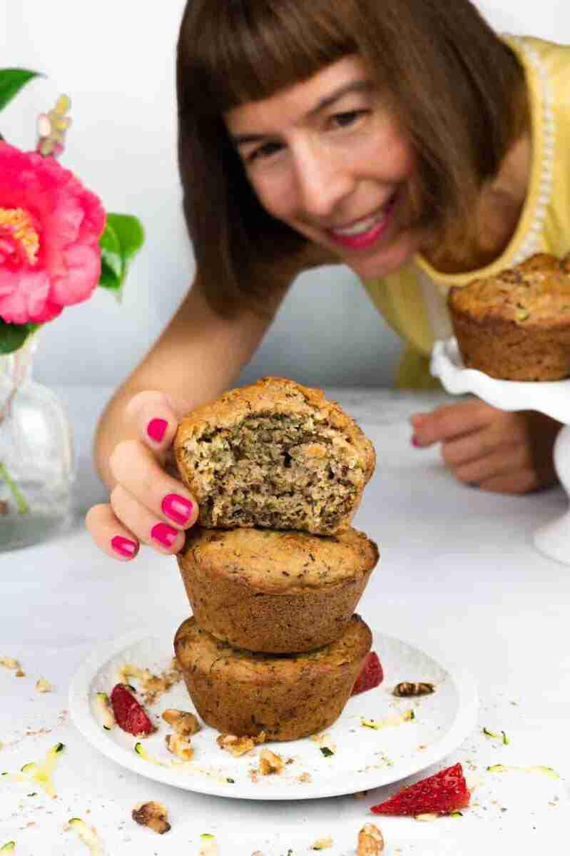 Cathy of Cathy's Cake Salon with a stack of protein zucchini muffins.