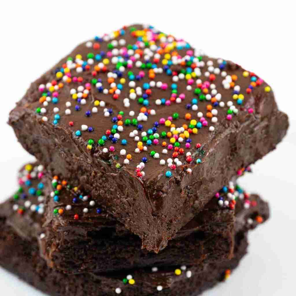 Keto sweet potato brownies with chocolate avocado frosting and sprinkles.