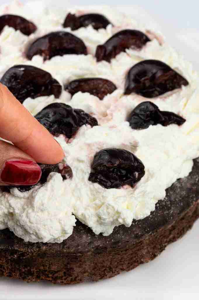 A step in the recipe where the sliced cherries are placed.