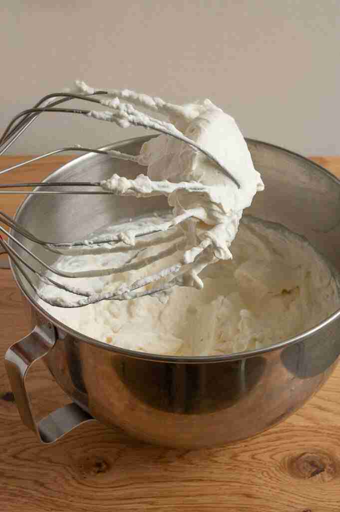Making whipped cream with stiff peaks for this recipe.