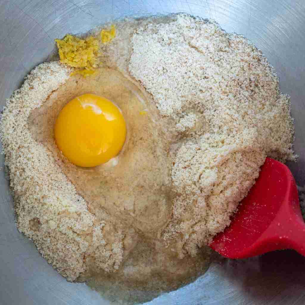 Step 3 in the low carb stollen recipe: Adding the egg, butter, vanilla, lemon zest.