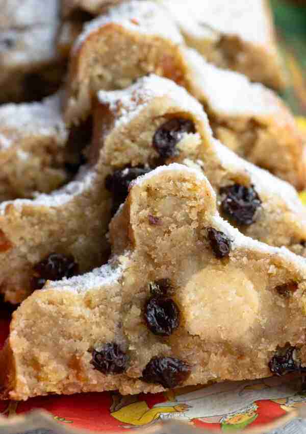 Slices of gluten free Stollen, a mini low carb Stollen loaf filled with keto marzipan.