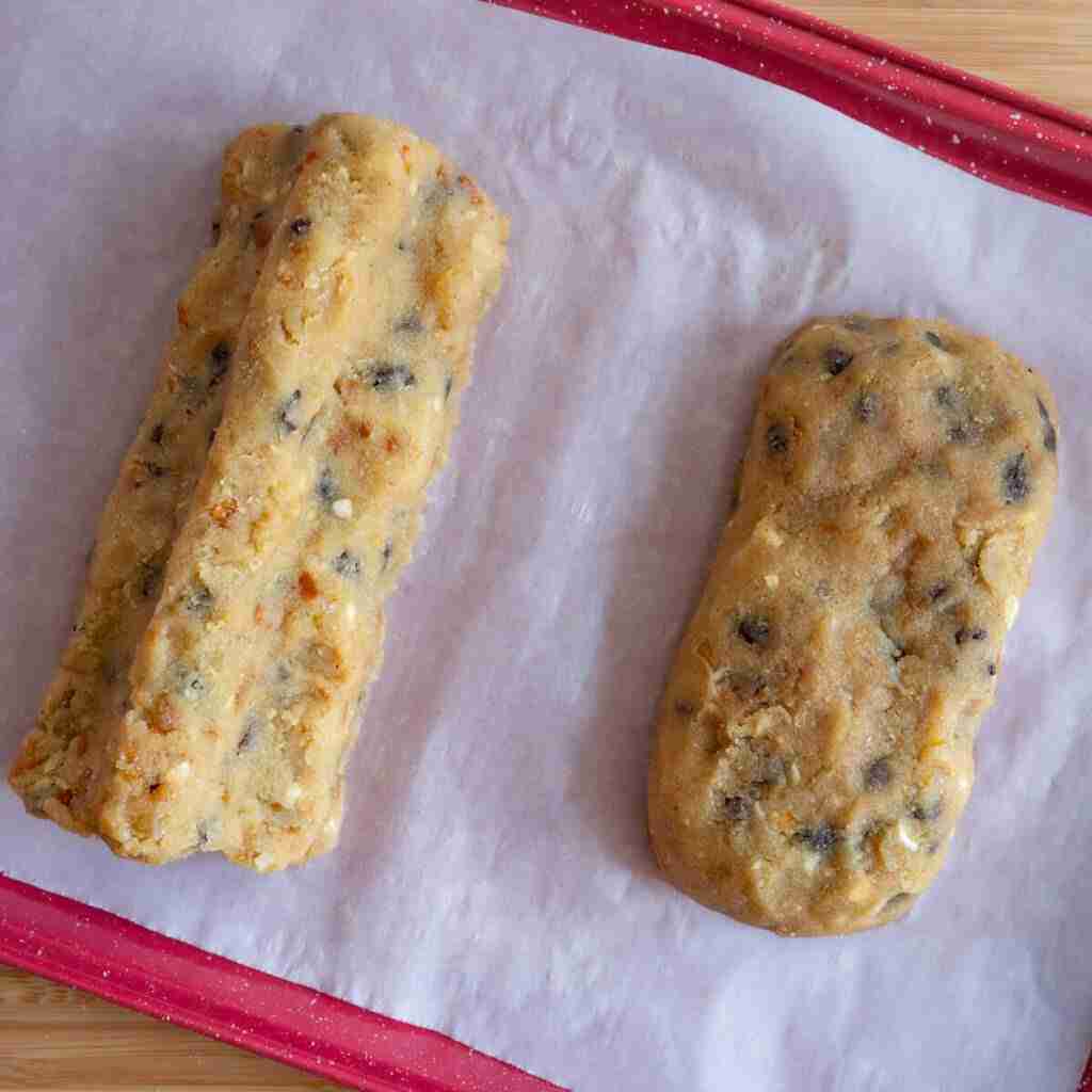 A step in the recipe: Placing the loaves on a baking tray.