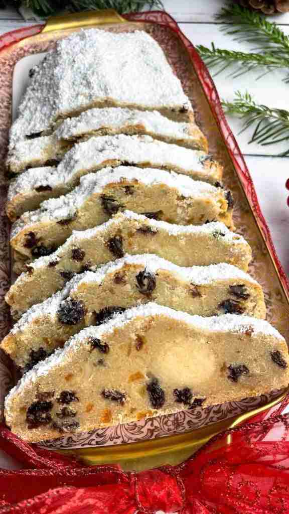 Slices of quark stollen, or German Quarkstollen, with marzipan and powdered sugar.