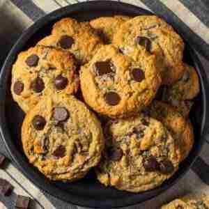 Vegan Peanut Butter Chocolate Chip Cookies on a black plate.