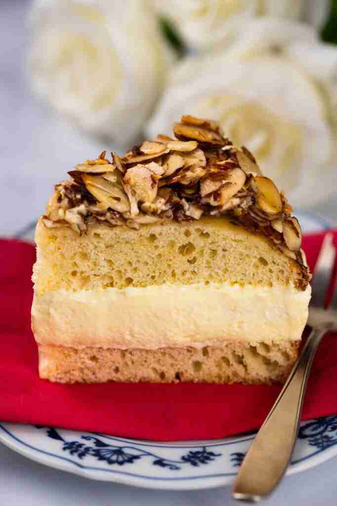 A slice of Bee Sting Cake or Bienenstich cake on a plate.