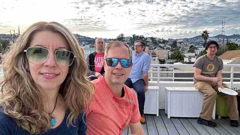 Guests on the deck with a view of San Francisco at the European dessert potluck.