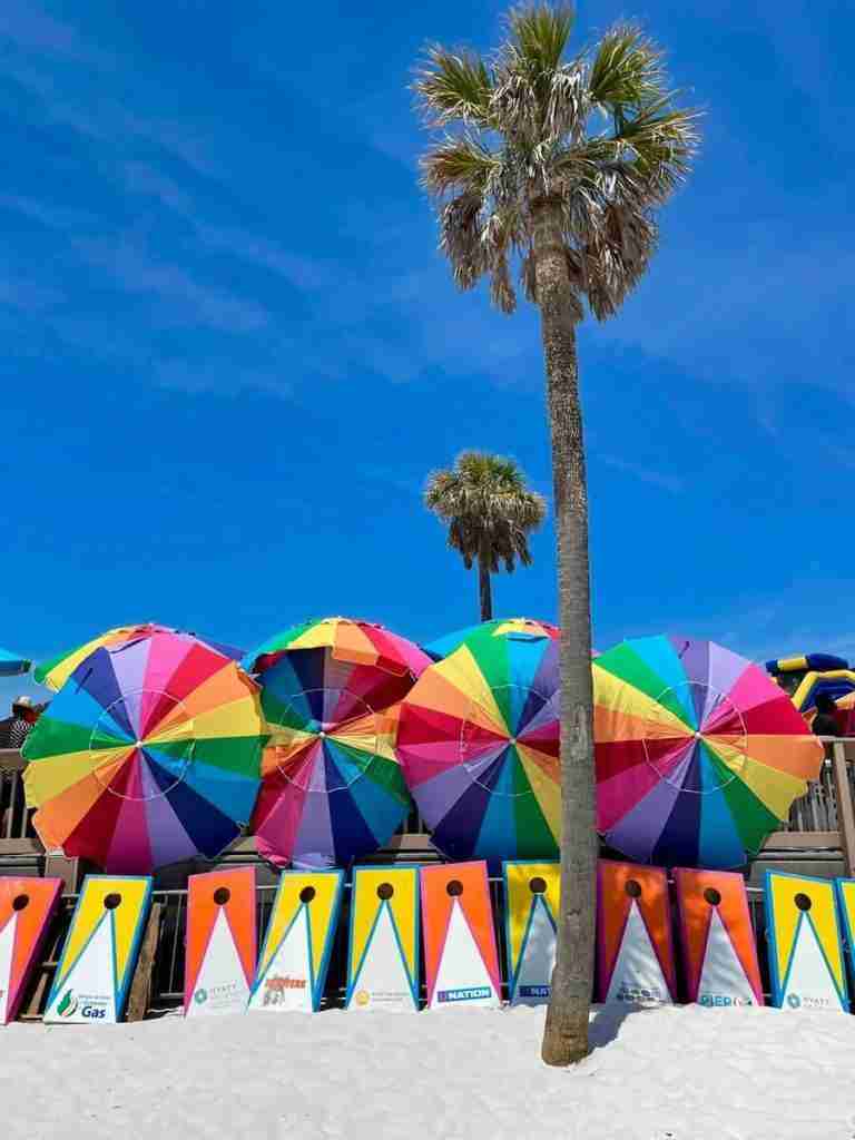 Colorful beach umbrellas on Clearwater Beach Florida as featured in the article entitled Can You Drive on Clearwater Beach?