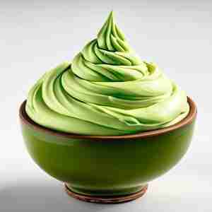 A bowl of healthy cream cheese avocado frosting, also called vanilla avocado frosting.