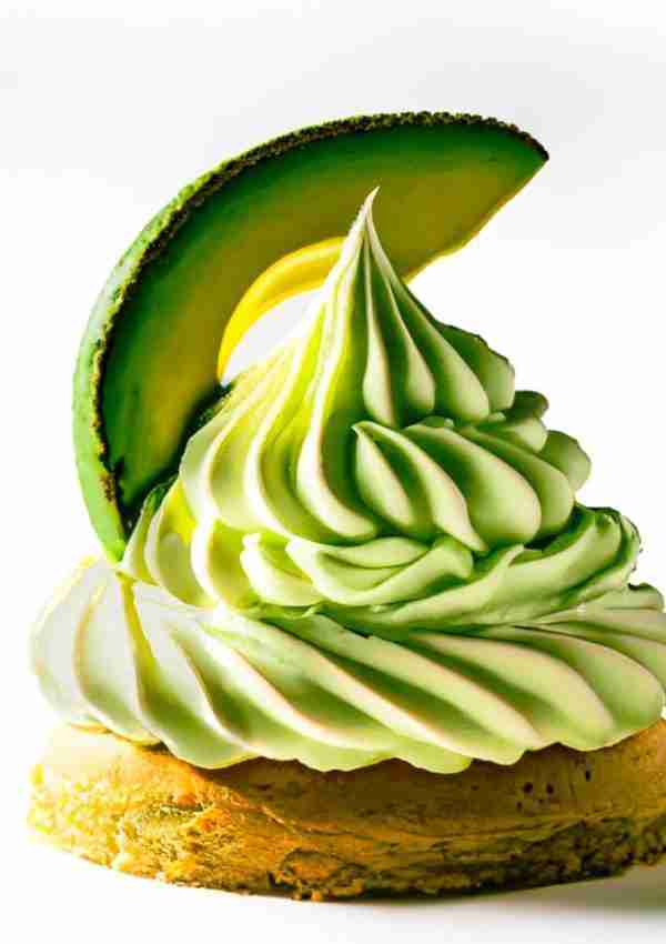 Cream cheese keto avocado frosting and a slice of avocado on top of a pastry.
