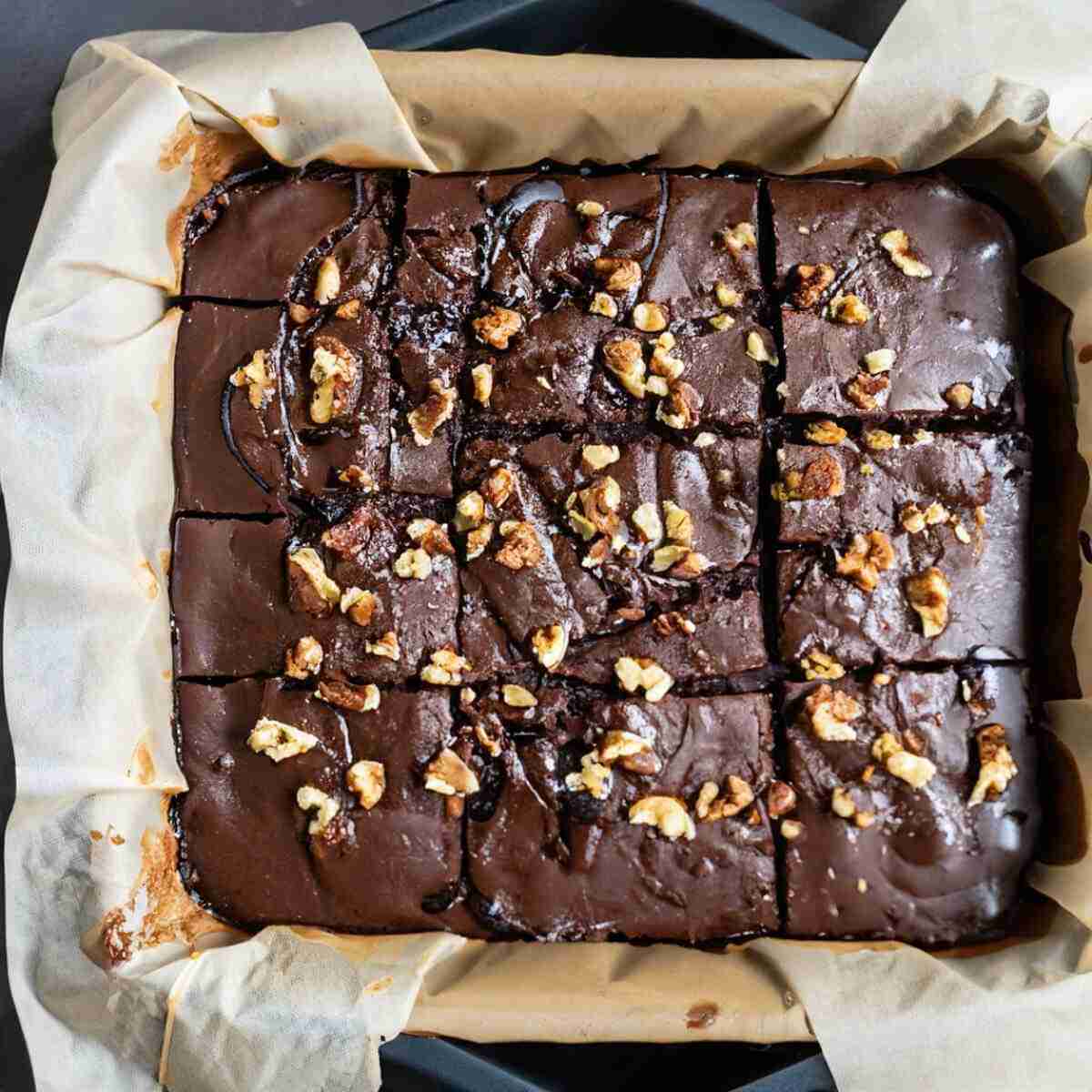 Gluten-free, paleo eggplant-almond brownies topped with walnuts.