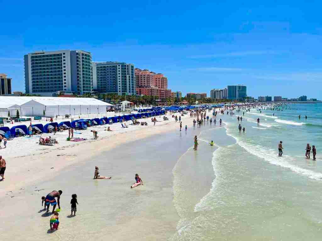 The beach and beach umbrellas and cabanas on Clearwater Beach, as featured in the article entitled Can You Drive on Clearwater Beach?
