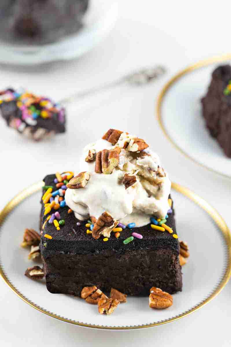 Black bean avocado brownies with a scoop of vanilla ice cream on top.