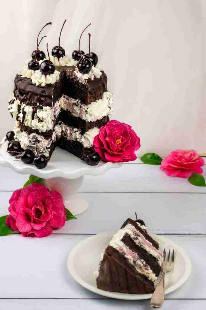 A 3-layer, 6 inch Black Forest Cake design and a slice of the tall cake.
