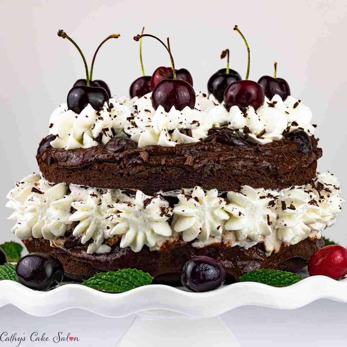 Keto black forest cake made with almond flour, dark chocolate and cherry brandy.