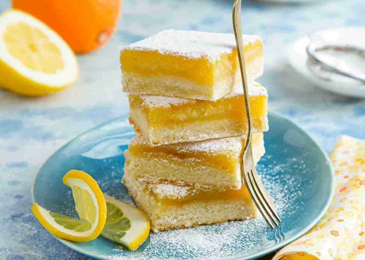 Sugar free lemon-orange almond flour bars topped with powdered zero-calorie monk fruit.