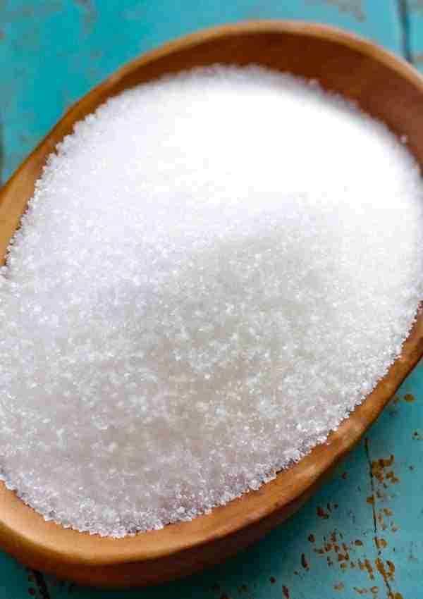 Monk fruit without erythritol: Here as granulated white monk fruit allulose blend in a brown bowl.