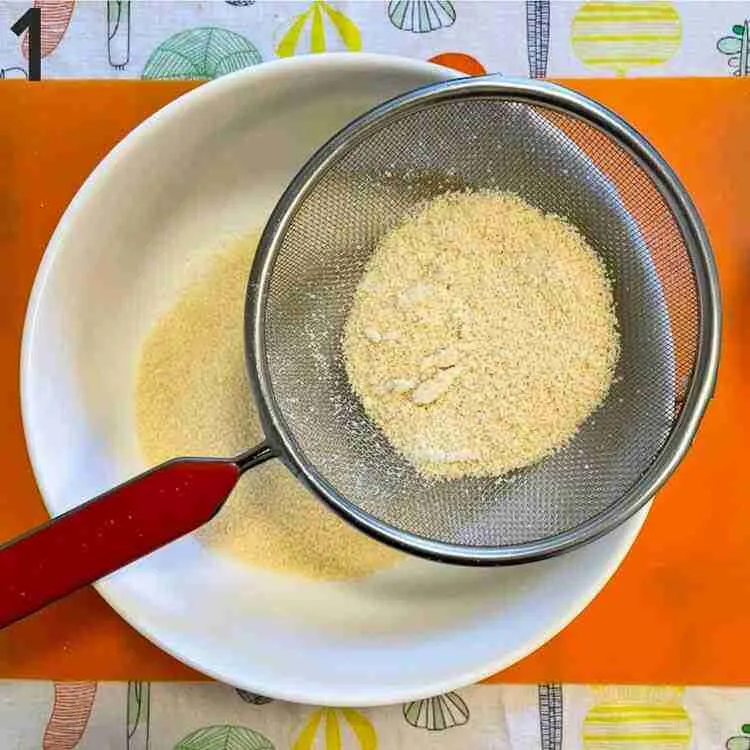 A step in the recipe: Sift the almond flour.