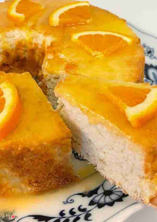 Keto orange angel food cake recipe: This keto orange cake is topped with a sugar free orange glaze and fresh orange slices.