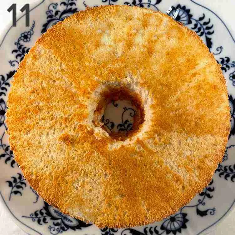 A step in the recipe: Remove the orange keto angel food cake from the pan.