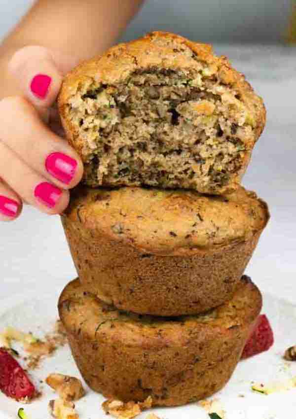 Three healthy protein zucchini muffins with walnuts.