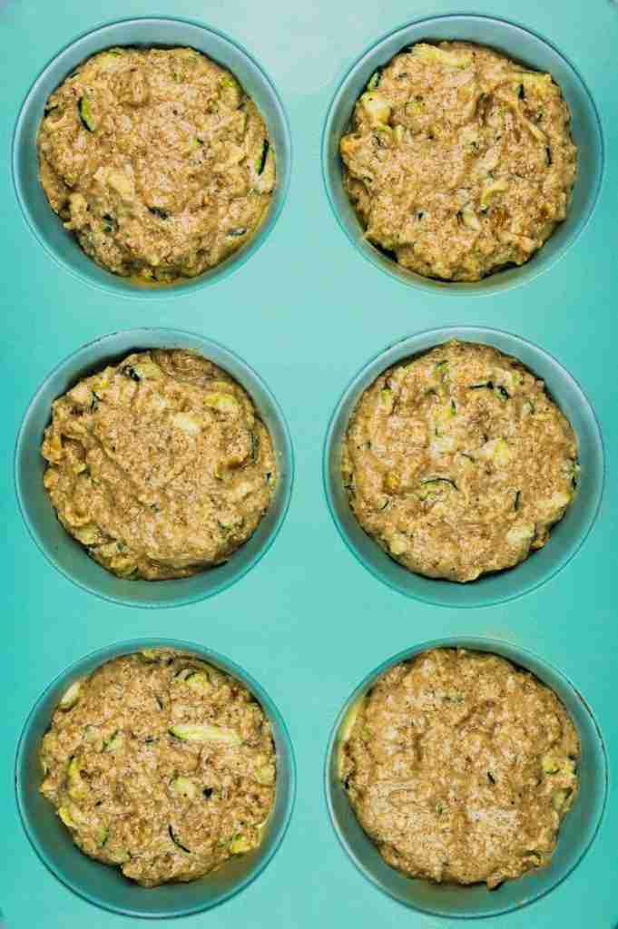 The unbaked cupcakes in a jumbo muffin tin.