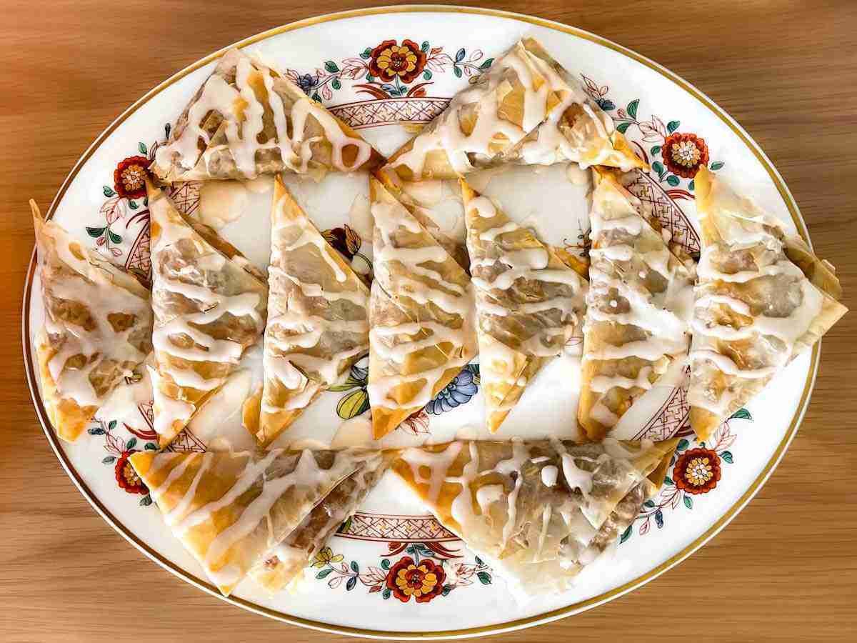Healthy Apple Turnovers glazed with Sugar Free monk fruit  icing on a plate.