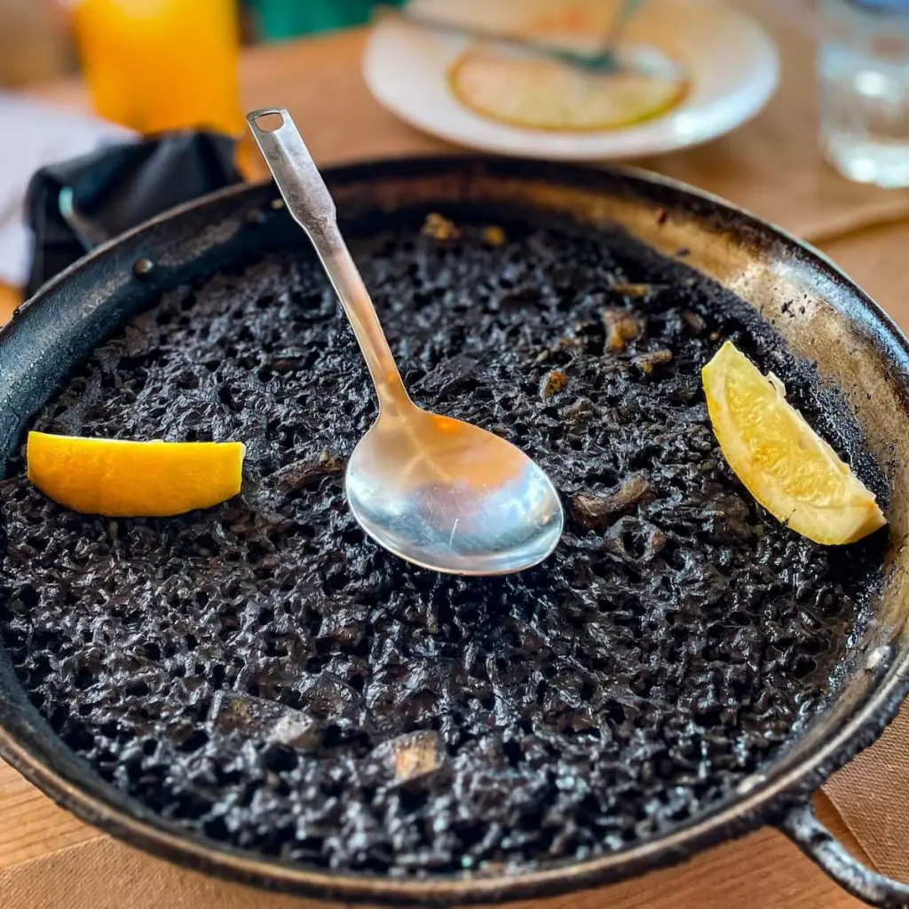 Black paella at Cerveceria Freiduria on Cabanyal Beach, Valencia.
