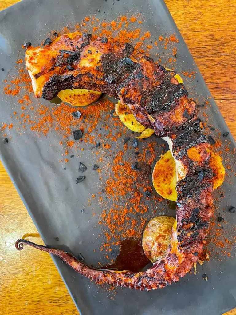 Best Cabanyal restaurants: Grilled octopus on potatoes at Cienfuegos in Valencia, Spain.