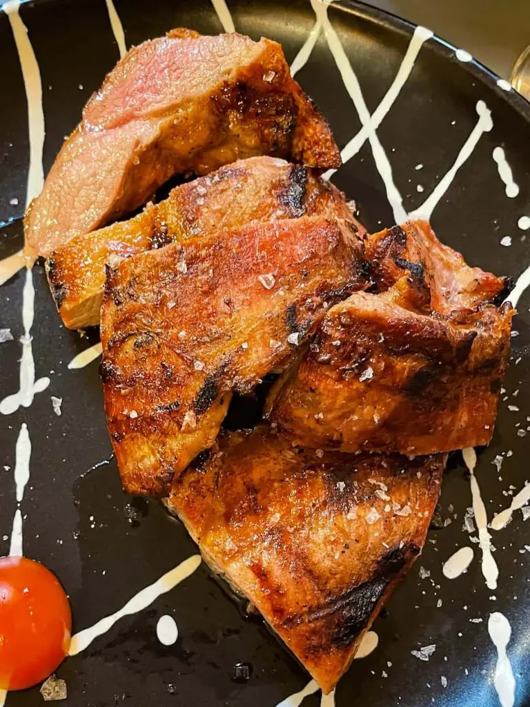 Best El Cabanyal restaurants: Grilled pork at Cienfuegos in the Cabañal-Cañamelar quarter of Valencia, Spain.