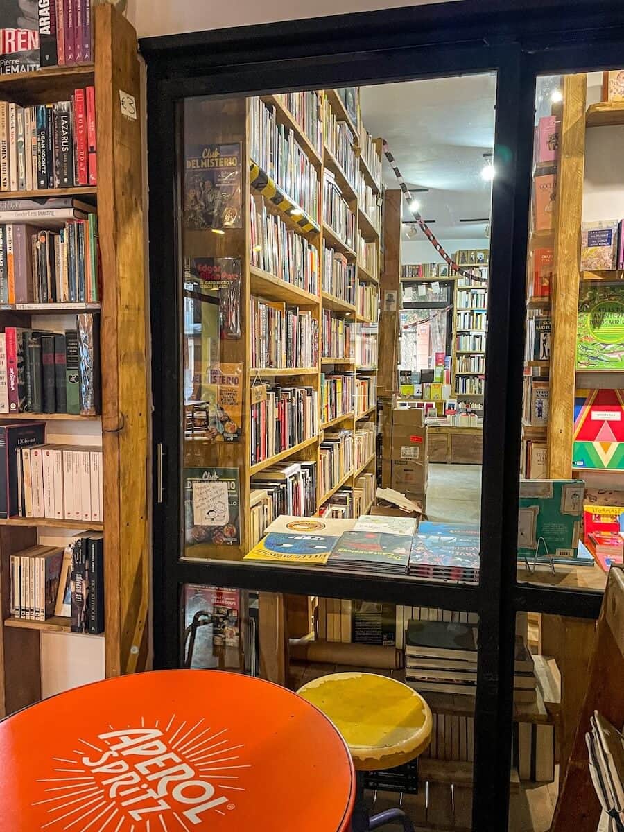 The glass window separating the restaurant from the bookstore at La Batisfera in the Cabanyal, Valencia, Spain.