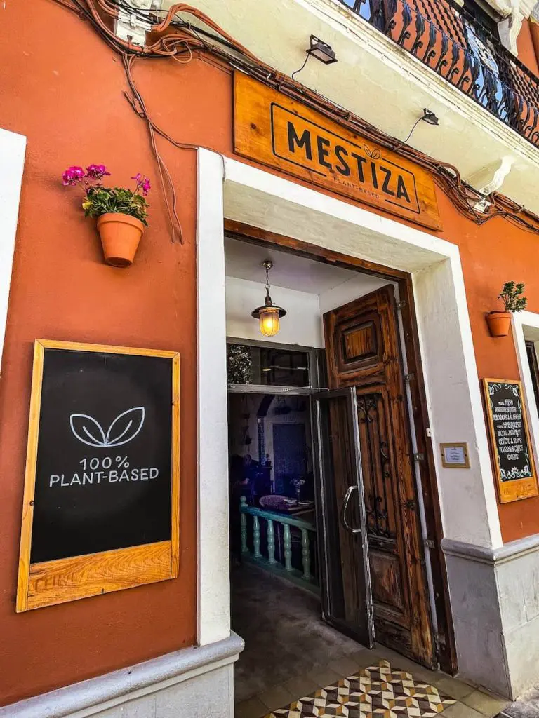 The front facade of Mestiza Plant-Based Restaurant in the Cabanyal quarter, Valencia, Spain.