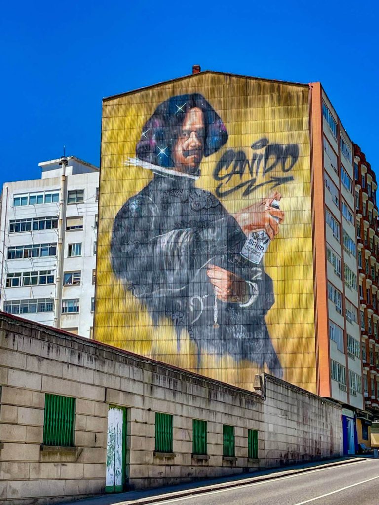 Mural by urban artist Sfhir in the Canido quarter of Ferrol. The mural is a tribute to Spanish baroque painter Diego Velázquez – with sparkles in his hair and clothing adorned with graffiti tags.