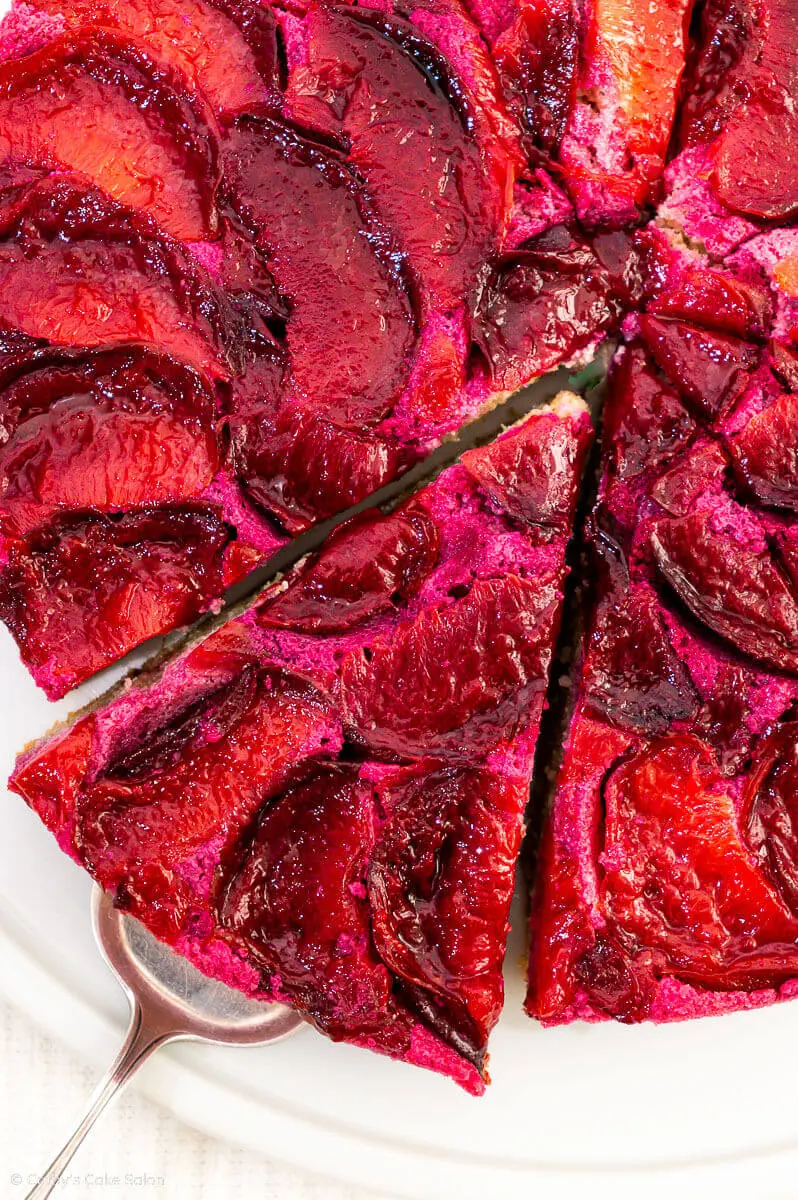 A slice of low carb, upside down Keto Plum Cake sweetened with monk fruit sweetener.
