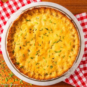 Keto chicken pot pie with a cheddar chive almond flour pie crust.