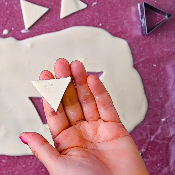A step in the recipe: Making white chocolate triangles.
