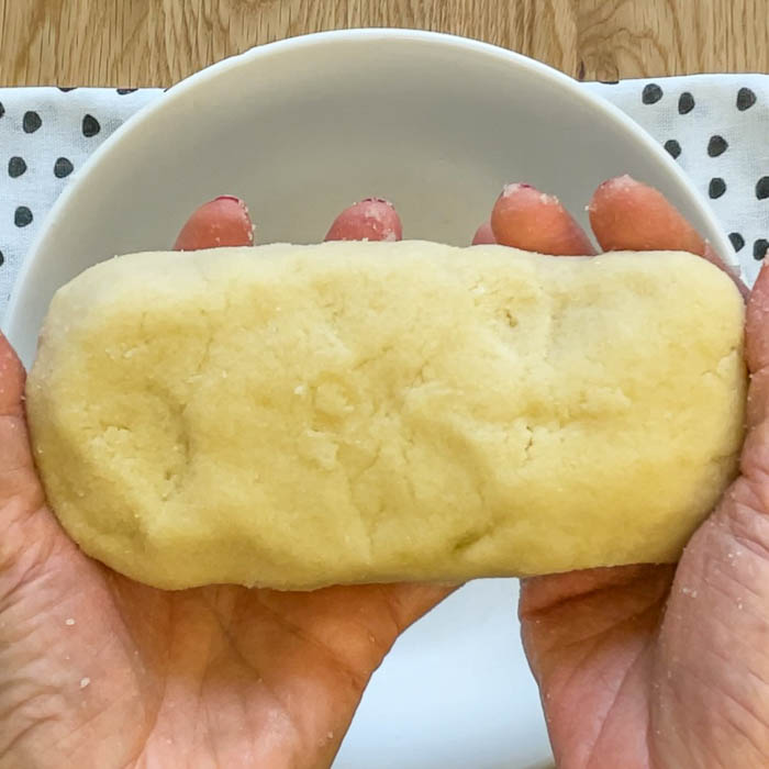 The final step in this sugar free marzipan recipe: Shape the marzipan into a loaf.