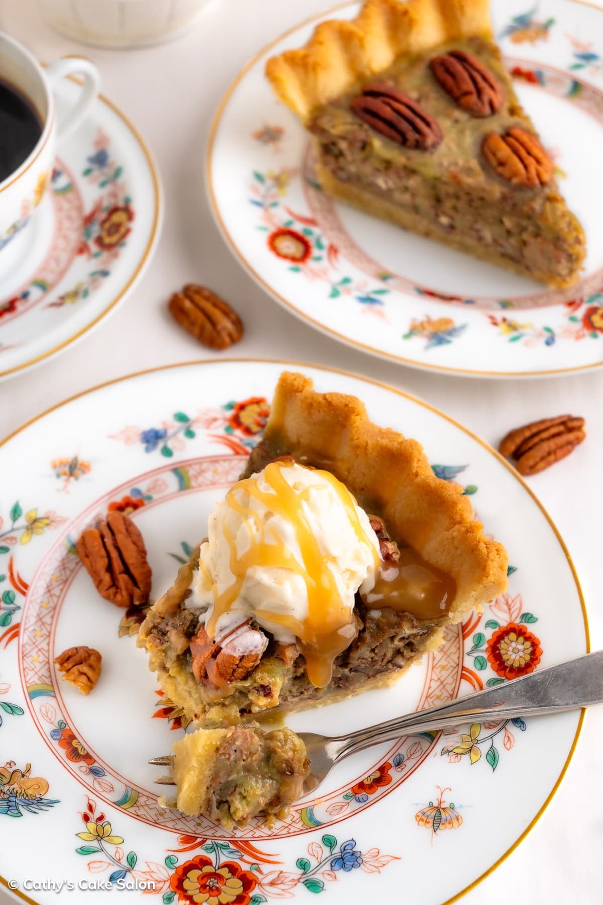 Slices of sugarfree pecan pie topped with pecans or sugar free vanilla ice cream and caramel sauce.