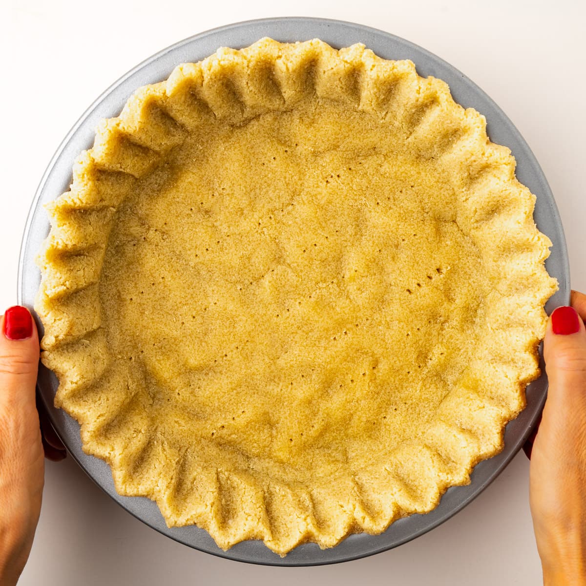 A step in the recipe: Partially bake the almond flour pie crust.