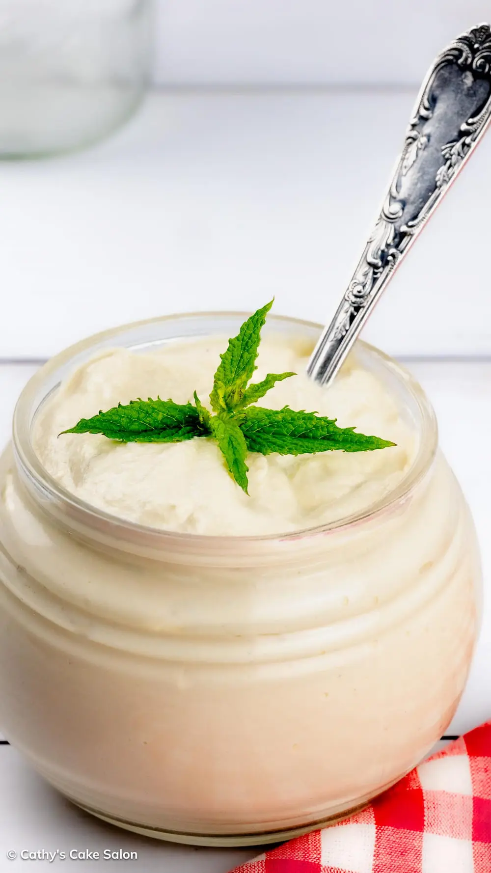 A spoon in a jar of this vegan alternative to mayonnaise.