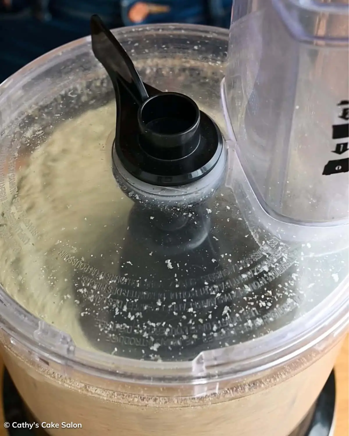 A step in the recipe: Blending the pumpkin seeds in a food processor.