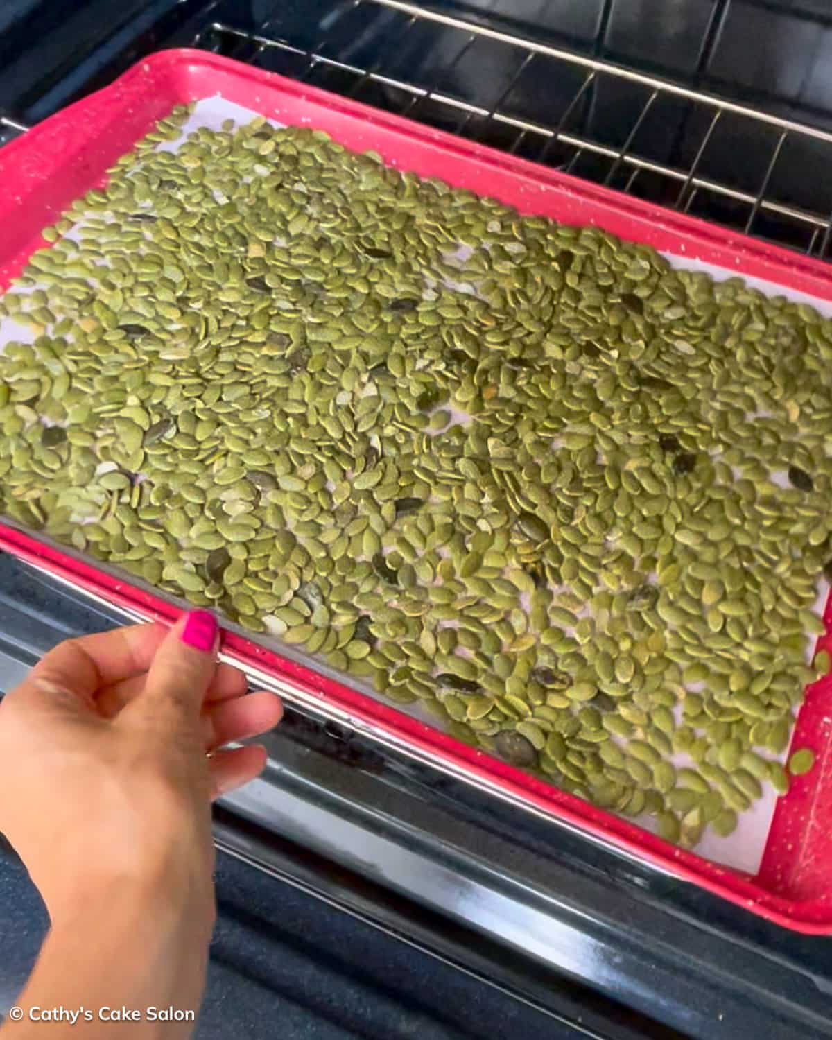 A step in the recipe: Roast the pepitas or pumpkin seeds in the oven.